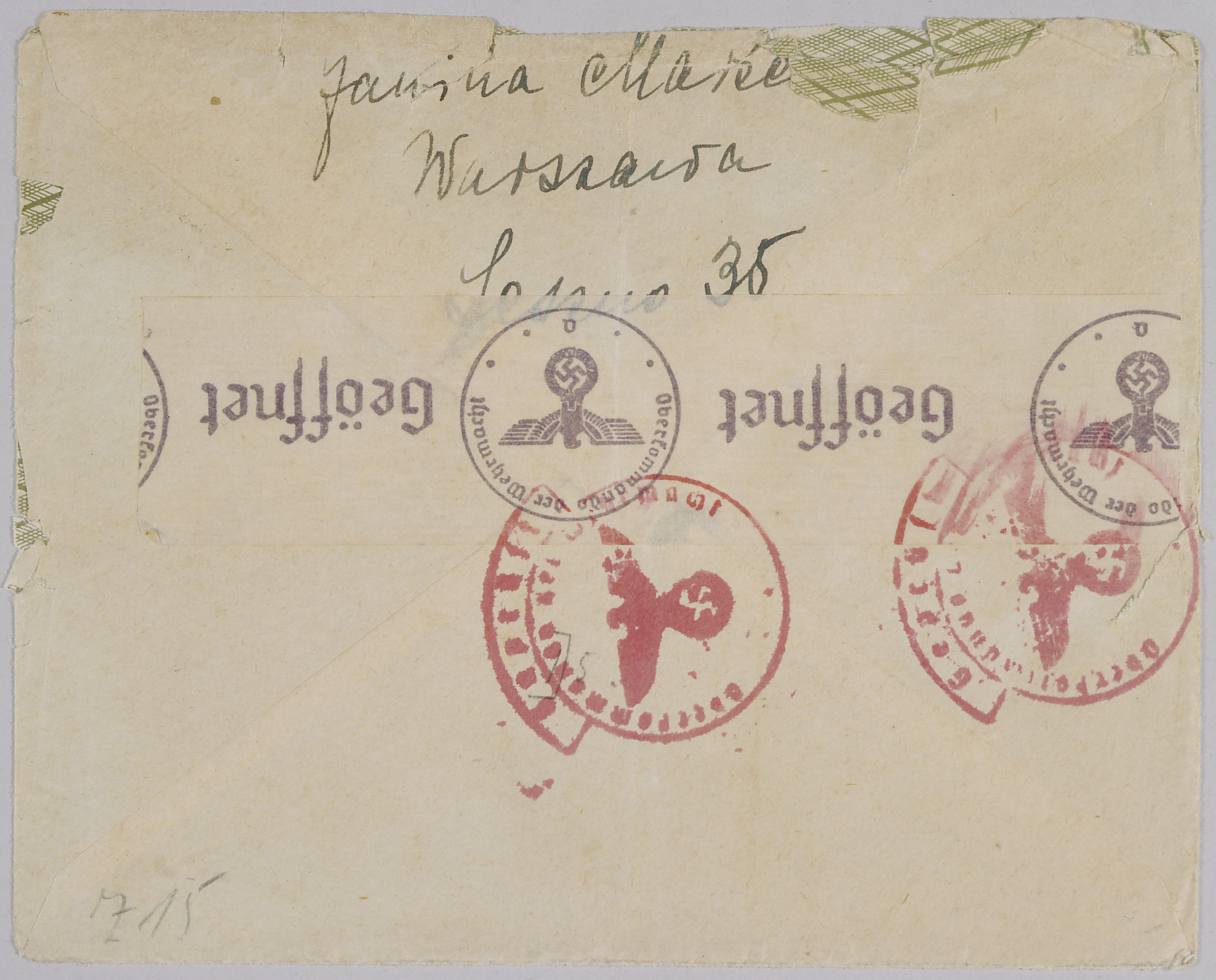 Verso of an envelope containing a letter sent from Warsaw to New York. It shows multiple German censor stamps, including paper stamps as well as ink stamp cancellations.