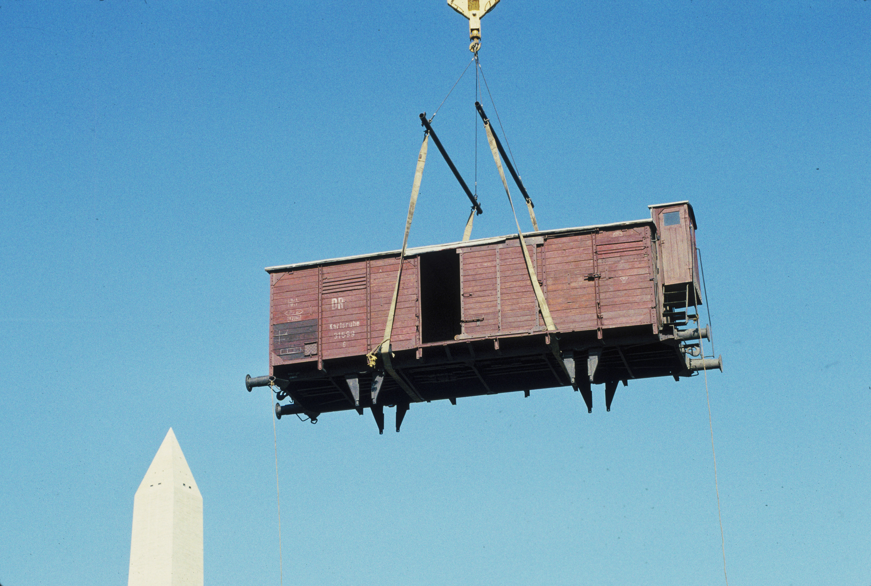 Installation of the railcar at the construction site of the U.S. Holocaust Memorial Museum.