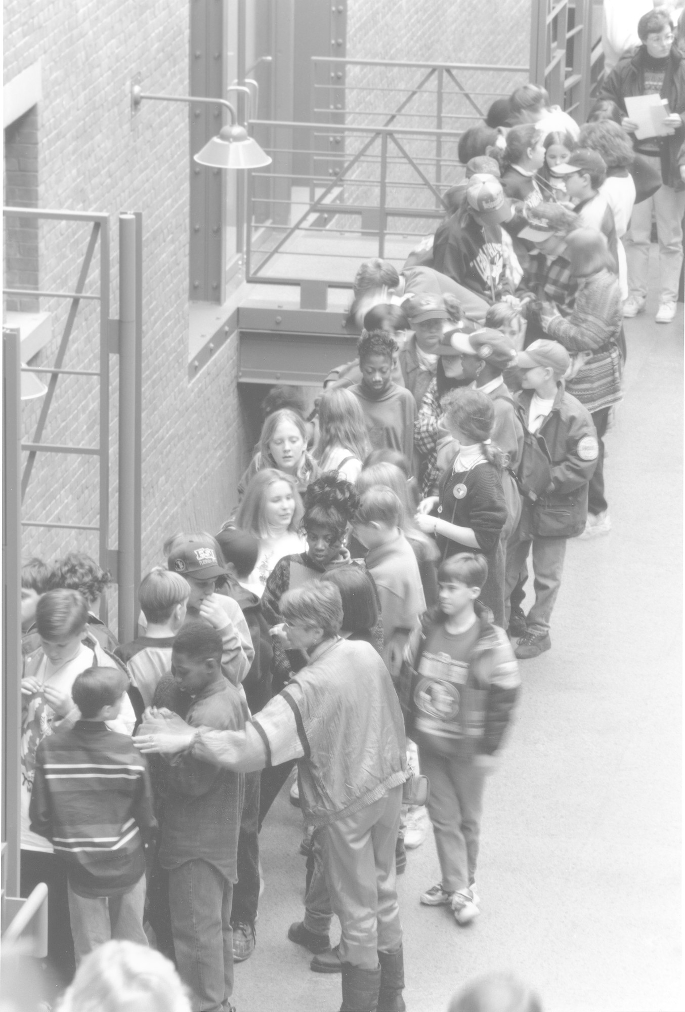 A group of school children enter the special exhibition "Daniel's Story: Remember the Children" from the Hall of Witness in the U.S. Holocaust Memorial Museum.