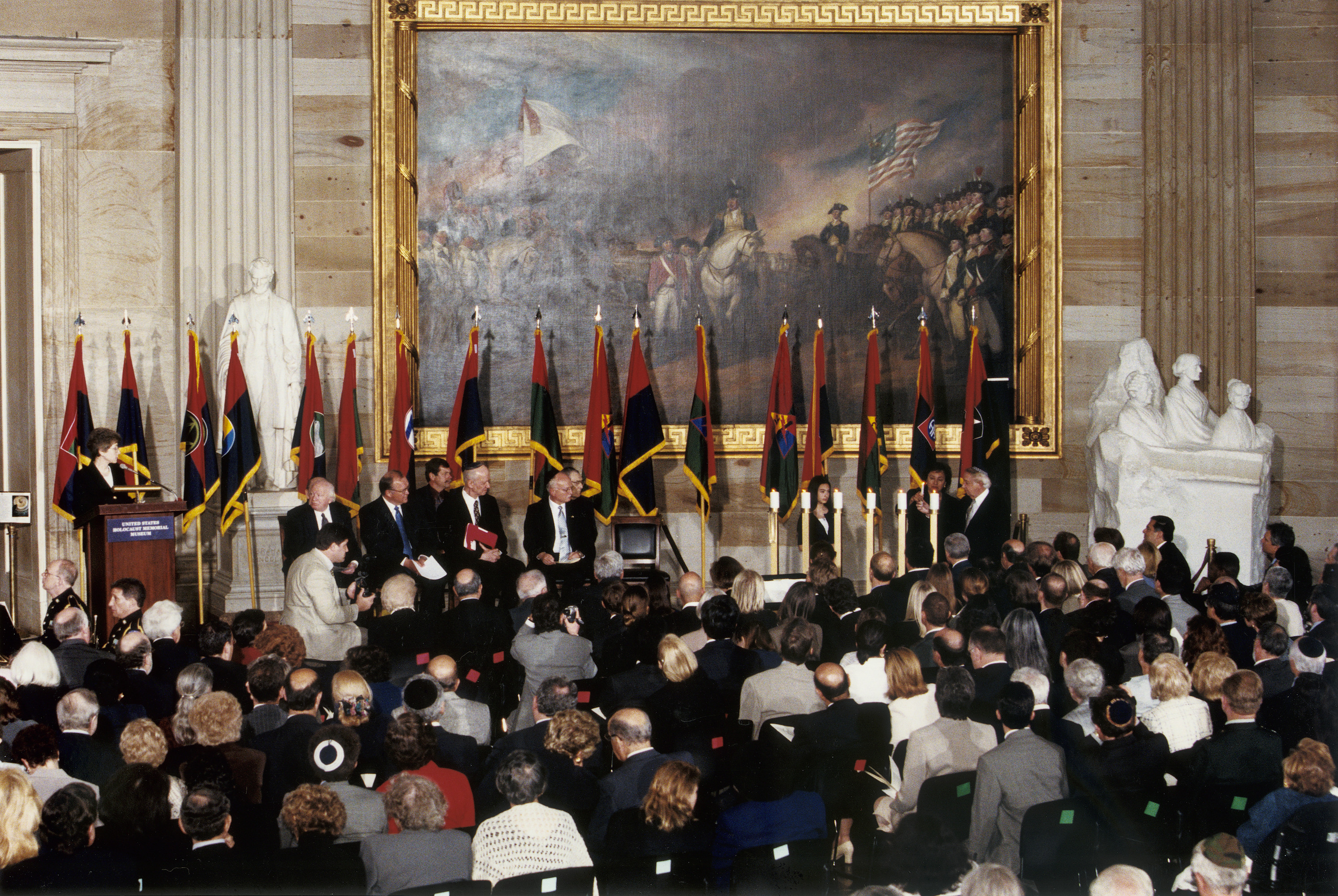 Nita Lowey and Abraham Zuckerman light a memorial candle during the 2000 Days of Remembrance ceremony in the capitol rotunda. 

The theme of this year's commemoration was "The Holocaust and the New Century: The Imperative to Remember."  Swedish Prime Minister Göran Persson delivered the keynote address, and Nobel laureate Elie Wiesel and U.S. Secretary of the Treasury Stuart E. Eizenstat were recognized for their extraordinary contributions.