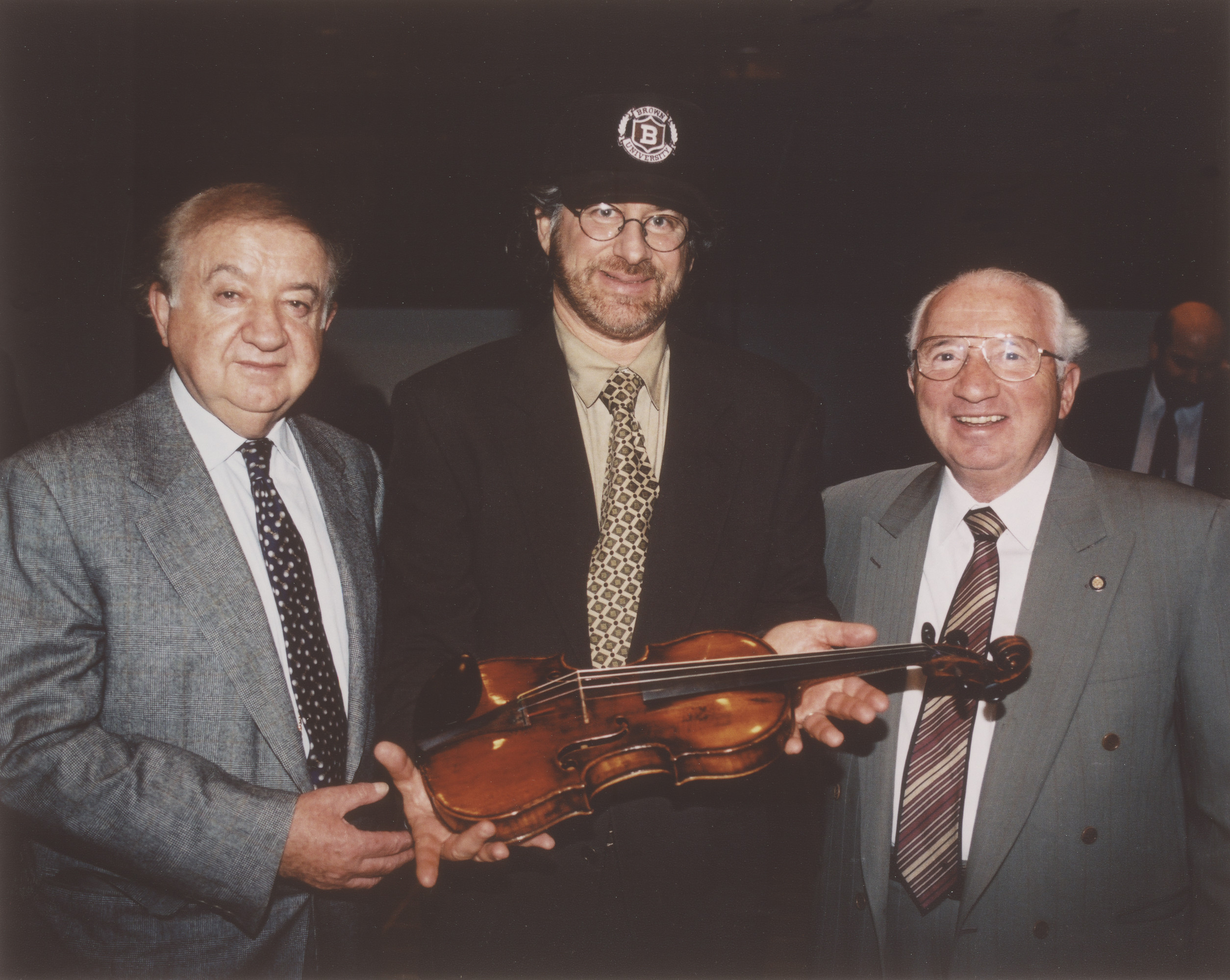 Steven Spielberg accepting the 'Schindler violin' (Henry Rosner's) on behalf of the USHMM. The violin was donated by Murray Pantirer and Abraham Zuckerman.