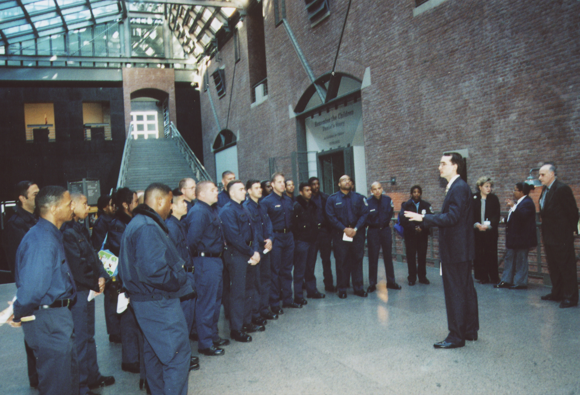 DC police training squad visits the U.S. Holocaust Memorial Museum.   Andres Abril begins the tour by speaking to the officers in the Hall of Witness.