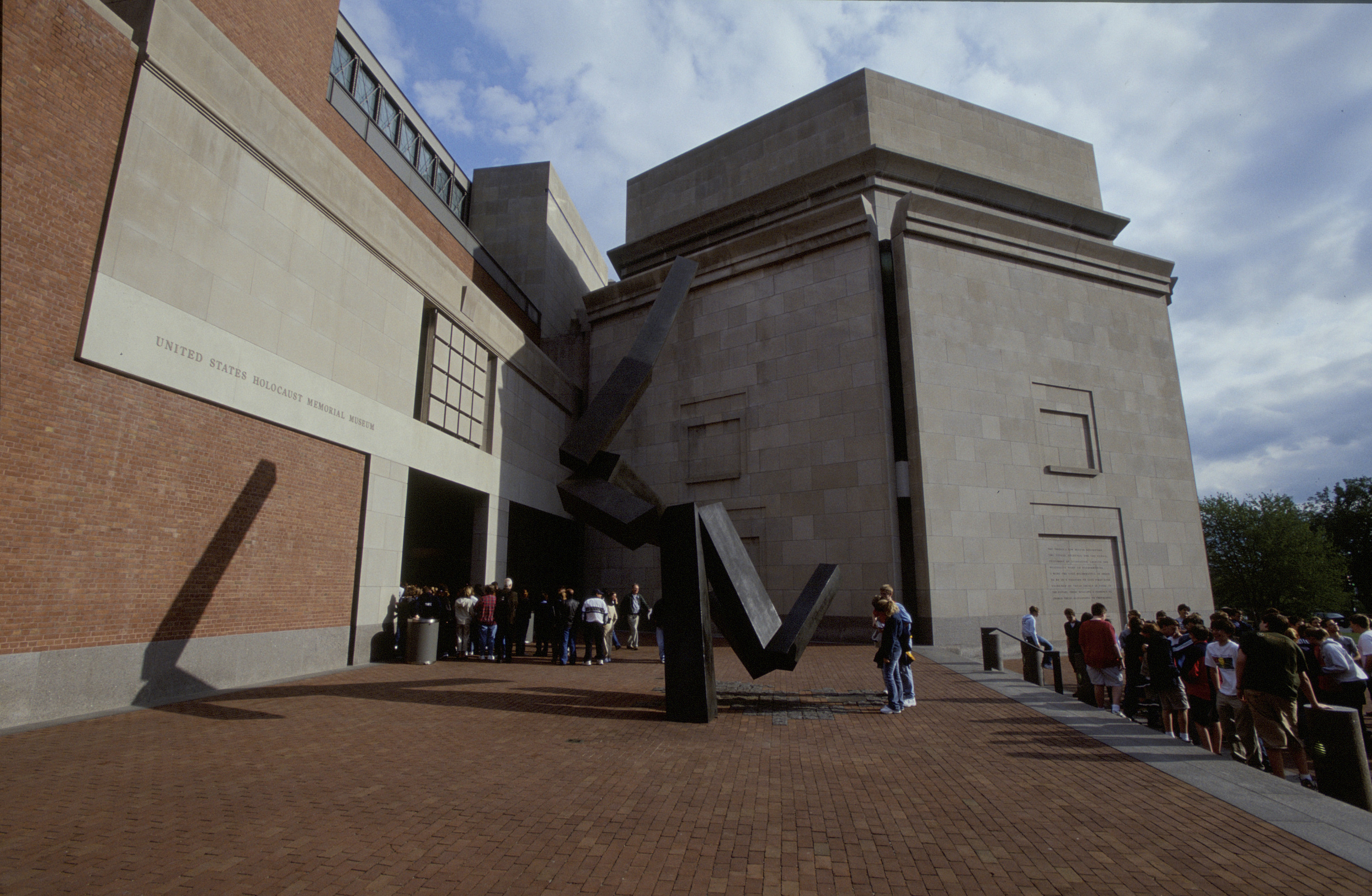 Visitors gather in Eisenhower Plaza outside the U.S. Holocaust Memorial Museum on the day of its 10th anniversary.