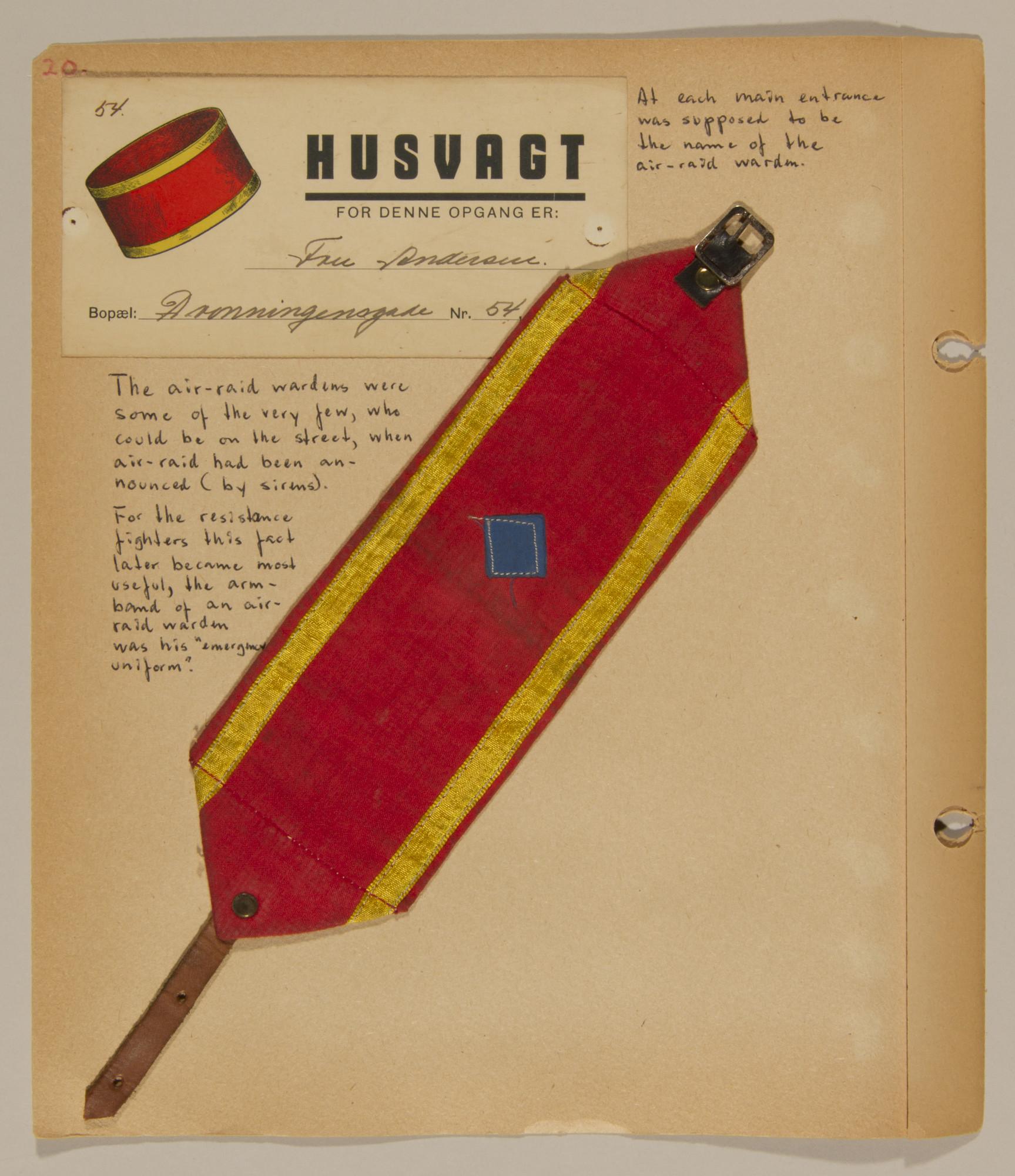 Page from volume one of a set of scrapbooks compiled by Bjorn Sibbern, a Danish policeman and resistance member, documenting the German occupation of Denmark.

This page contains the cloth armband of an air warden.