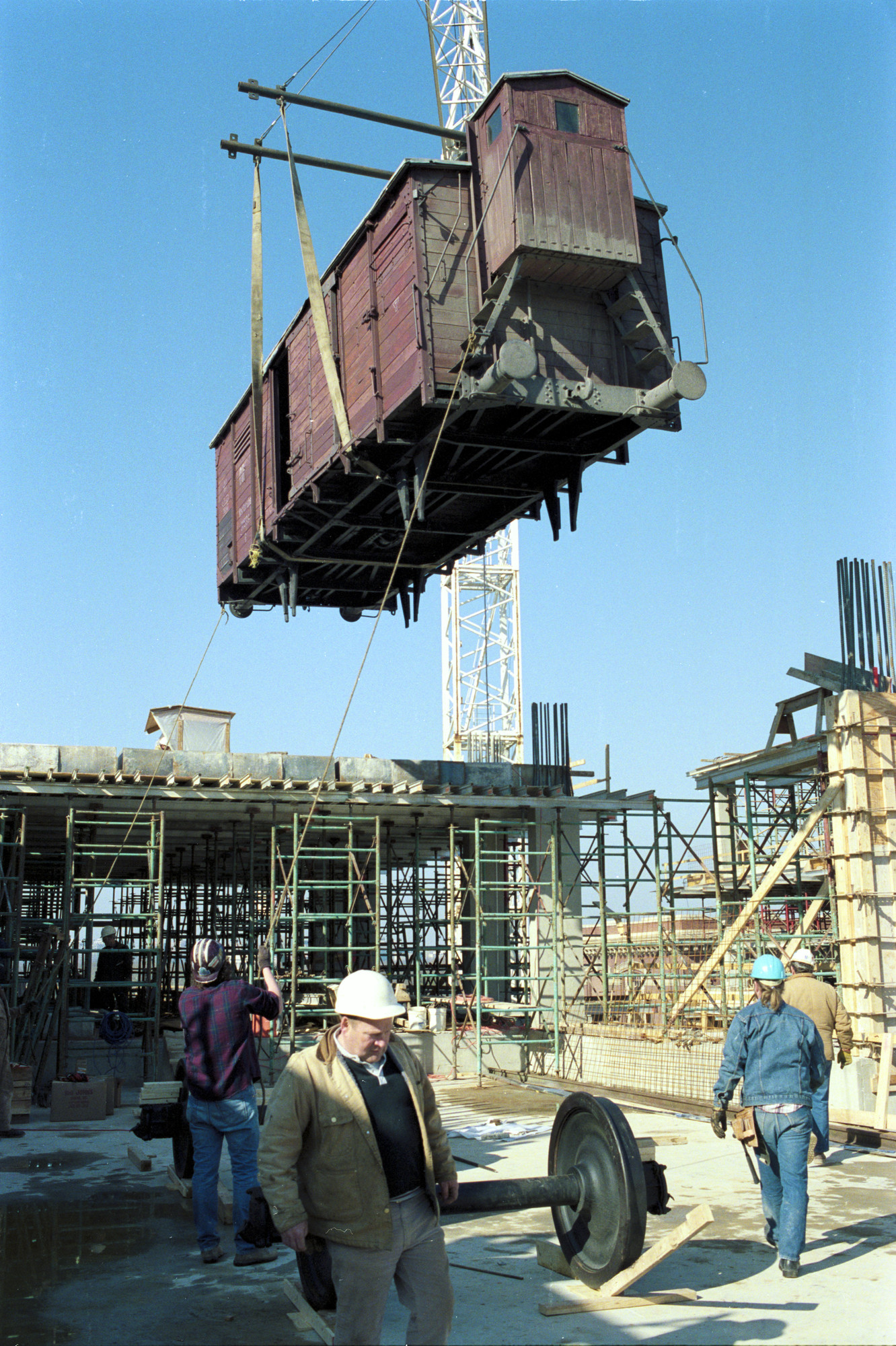 Installation of the railcar at the construction site of the U.S. Holocaust Memorial Museum.
