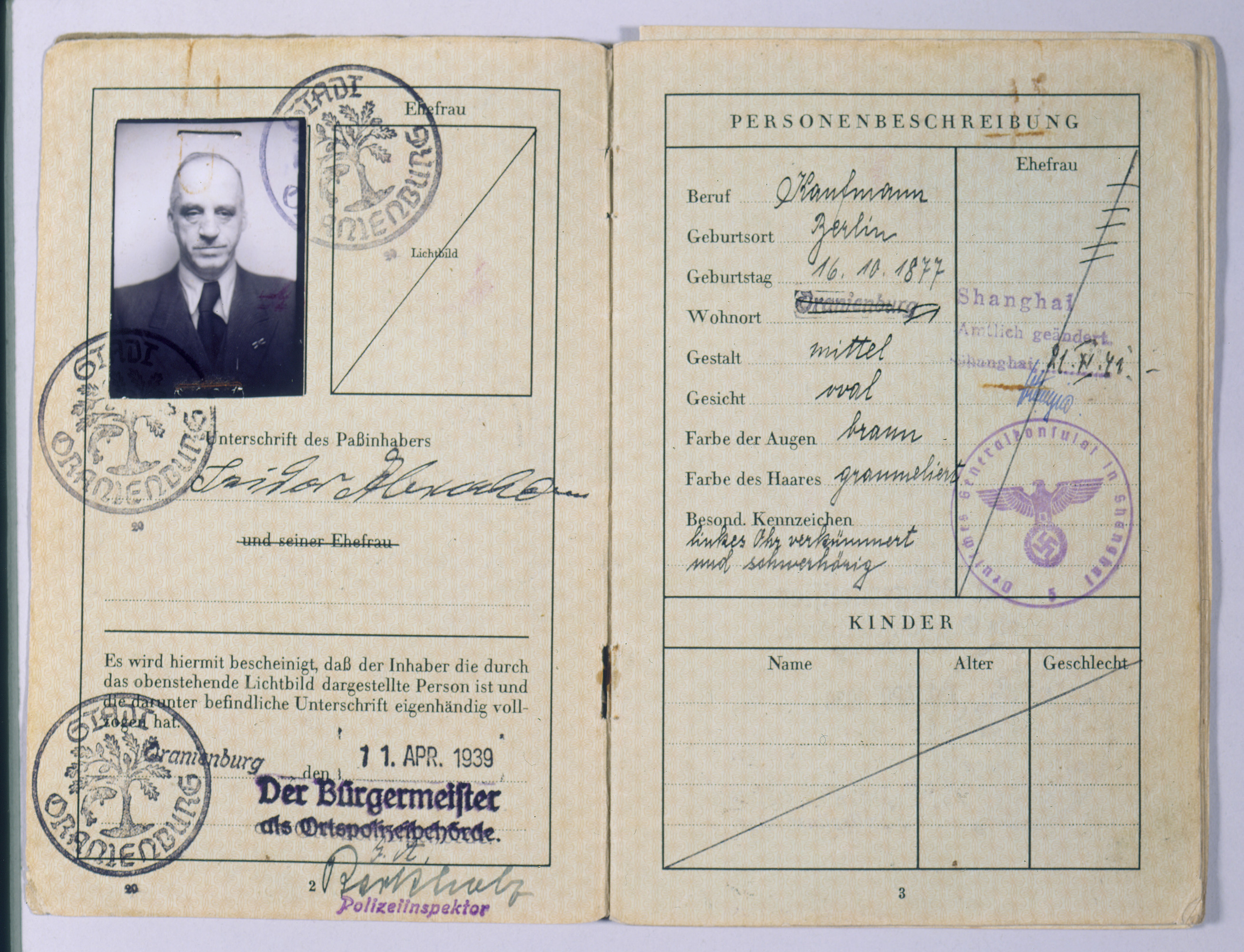 Pages two and three of the German passport issued to Isidor Abraham (the grandfather of the donor's wife) on April 11, 1939. 

Persecution of Jews in Hitler's Reich intensified in 1938. All passports held by Jews were stamped with a red "J." Fleeing Germany after the nationwide, Nazi-organized attacks on Jews and Jewish property during November 8-9, 1938 (Kristallnacht), Isidor Abraham's family emigrated from Berlin to Shanghai, which did not require a visa for entrance. Abraham later died in Shanghai.