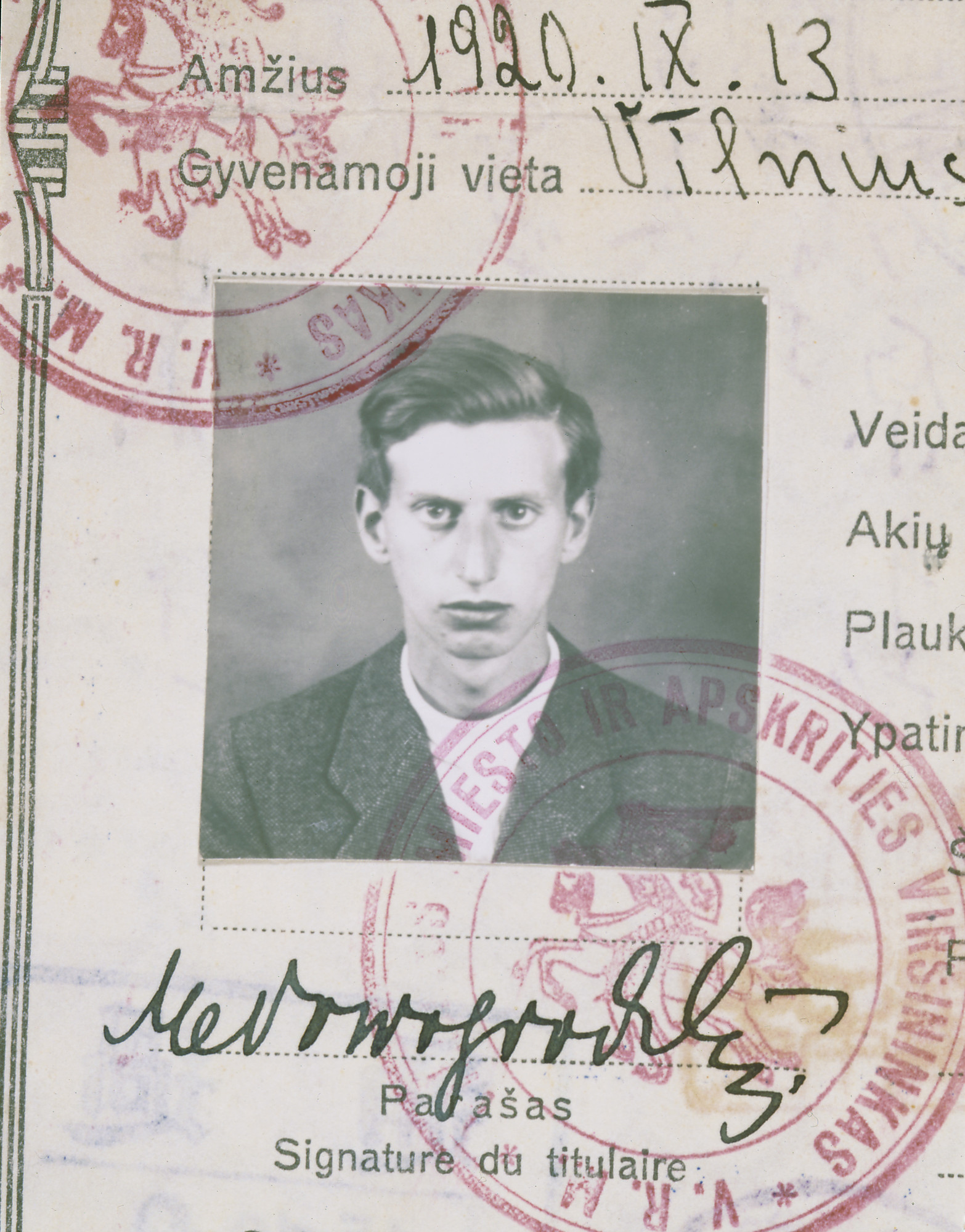 A closeup of the identification photograph adhered to the Lithuanian Safe Conduct Pass issued to Markus Nowogrodzki. This pass was eventually bound into a passport. It contains Sugihara ink stamps, two Russian transit visas, a Lithuanian stamp, an American non-immigration visa, and a Seattle entry stamp.

Sugihara visa (center left) issued with a legitimate emergency ("non-immigration") visa for the U.S. (bottom, far left) obtained in Kaunas in July 1940, one of only a few dozen U.S. visas issued before the consulate closed in mid-August, 1940.