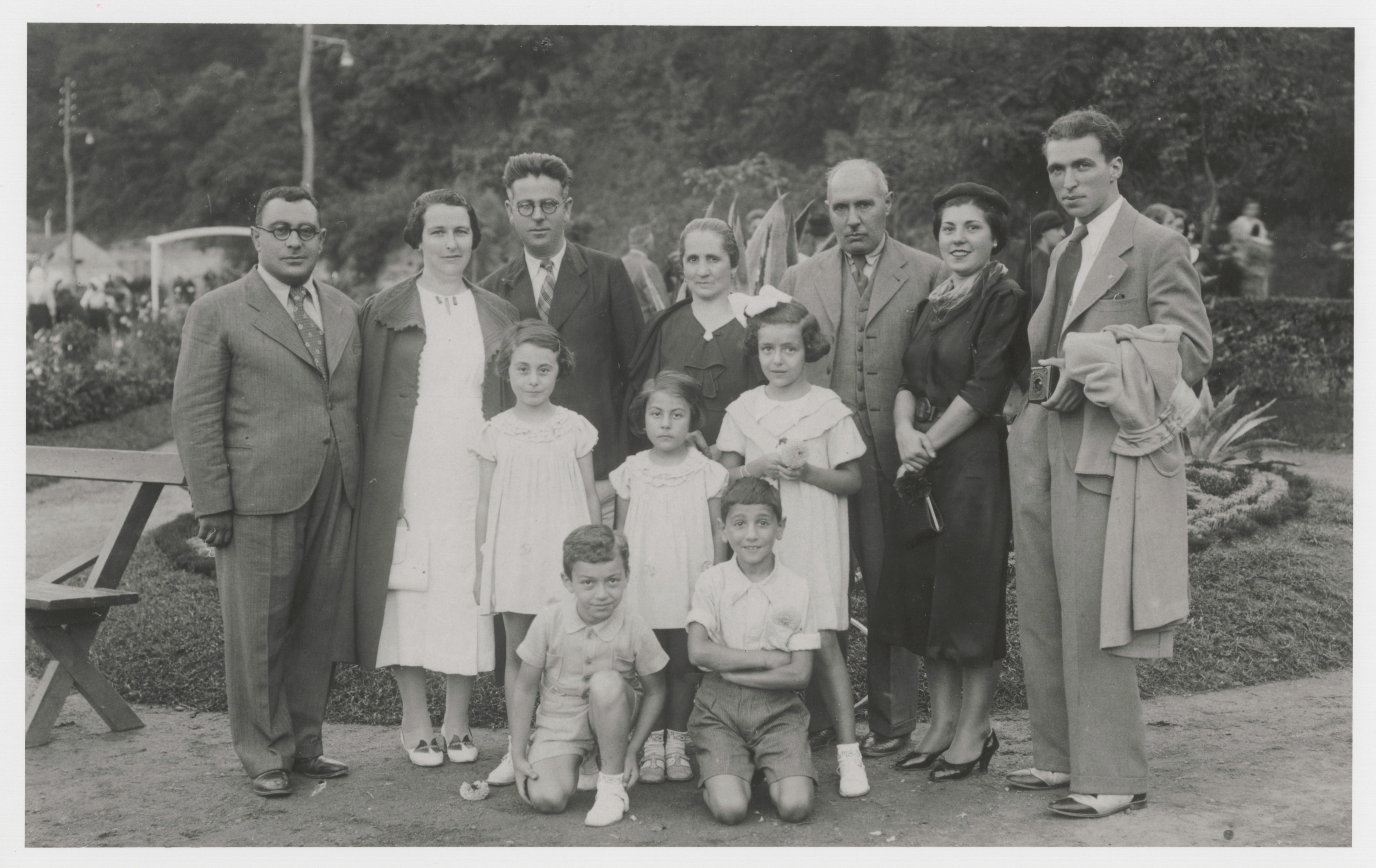 A group of friends on summer vacation at the sulfur baths at Vranjska Banja.

Among those pictured are Mato (nee Franco) Nahmias (back row, fourth from left), Avram Nahmias (back row, third from right), and Victor Nahmias (kneeling in front, on the right).