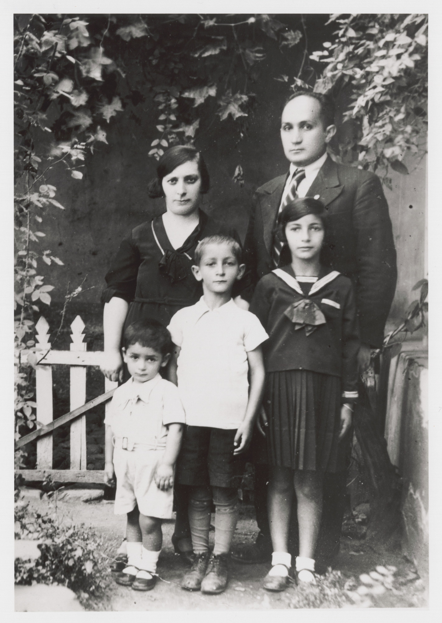 Portrait of the Nahmias family.

Pictured are parents Elvira and Isaac, with children Albert, Victor, and Stella.