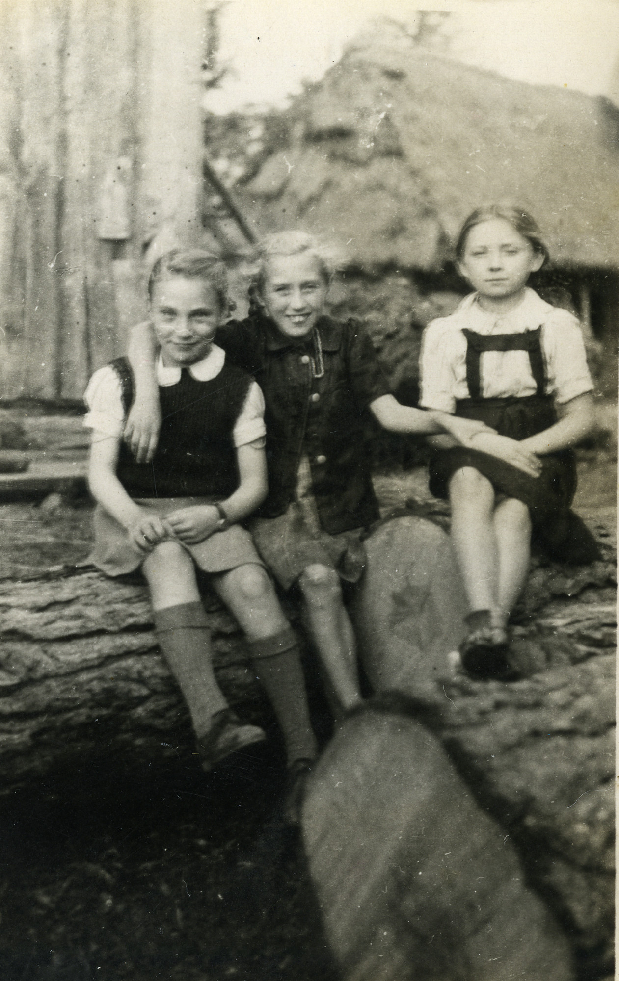 Genia Miedzyrzecka (far left) poses with two Polish girls while in hiding outside Warsaw.