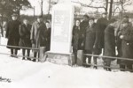 Survivors surround a gravestone in the Chrzanow Jewish cemetery,  placed in memory of the Jews of Trzebinia and Chrzanow who were murdered in September 1939.