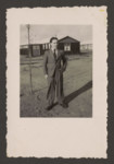Erich Rosendahl stands in front of the barracks  in the Westerbork transit camp.