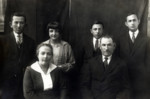 Studio portrait of the Ridnik family.

Back row left to right: Pesach, Dina, Leon and Yaakov (Jankl) Ridnik.