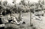 A family sunbathes at the Bergen-Belsen displaced persons camp.