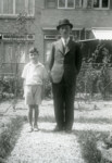 A Jewish father and son pose together in front of a building in Rotterdam.