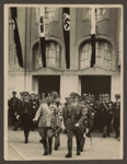 Adolf Hitler receives Benito Mussolini at the Heerstrasse Bahnhof in Berlin.