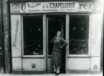 Rachelle Flantzer poses in front of her millinery shop in Paris.