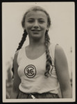 Close-up portrait of Gertrud Goldschmidt, a student from the Lenore Goldschmidt School, during a track and field event.