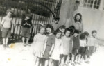 Children line up with their teacher in the Neu Freimann displaced persons camp.