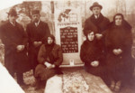 The Kuperberg family visits the grave of Pinchas Kuperberg.