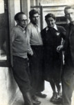 Four writers and activists gather on  the balcony of their home in the Vilna ghetto.