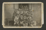 A Polish Jewish family gathers for a photograph.

Among those pictured are (front row, left to right) Yoel Ullman and brothers Moshe and Mayer Spiro.