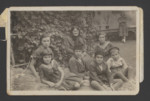 A Polish Jewish family gathers for a photograph in the backyard of their home in Nowy Sacz.