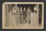 A Polish Jewish family gathers on a porch for a photograph.