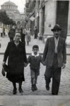 A Bulgarian Jewish family walks down the streets of Sofia, hand in hand.