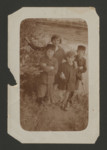 Children from a Polish Jewish family gather for an outdoor photograph.