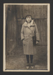 Blima Spiro stands for a photogragh in the backyard of her family home in Nowy Sacz.