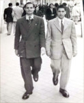 Raimond Zagron (right) and a friend walk down the street in Tunis.
