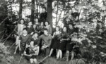 A group portrait of childen among a grove of trees, at a children's home in Aische en Refail.