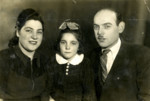 Portrait of Ester Bachar (now Levi)  with her parents Yaffa and Kalman Baruch, shortly before their immigration to Israel.