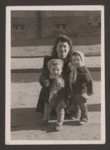 Chaya (nee Markman) Presseizan (later Peres) kneels behind her son, Elchanan (left) and an unidentified child in the Wetzlar displaced persons camp,1948.