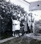 The Reichman family gathers in their yard for a photograph.