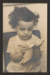 Elchanan Peres draws on a tablet of paper, Karkur, Israel, circa 1949.