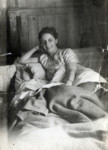 Fanny Marcus relaxes in bed in the Montana refugee camp in Switzerland.