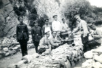 Members of a forced labor bridage in Bulgaria receive ladles of food.