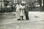 Dr. Georg Kollman (left) stands with a nurse and an UNRAA staff member, probably on the Rothschild hospital grounds.