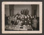 Survivors gather for the first Purim party in Namur, Belgium after the end of the war.