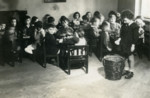 Kindergarten children sit at their desks at a school in Zilina.