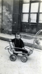 Two-year-old Lazare Tannenbaum sits in a baby carriage in Moirans, France.