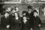 A French Jewish family poses for a photograph.

Pictured on the far left and right are grandparents Mirel (Perl) and Lazar Tannenbaum.