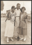 Ernestine (Ily) Munk, her brother Louis Munk, and his sister-in-law Macko Garay (nee Adler) pose together at a tennis court.