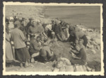 Jewish refugee women who were passengers on the the Pentcho work together  [possibly on some netting], while shipwrecked on the the island of Kamilonissi.