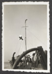 Passengers raise a white flag with Red Cross above the Pentcho after its shipwreck.
