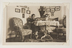 Therese Bloch-Bauer sits and reads in her parlor.