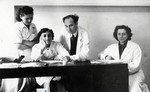 Group portrait of four students at the Bucharest Medical School.