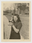Lenka Gruenberg fixes her hair in the mirror whlile standing outside the Deggendorf displaced persons camp.